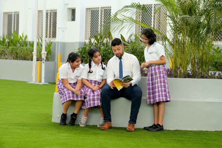 students sharing ideas with teacher