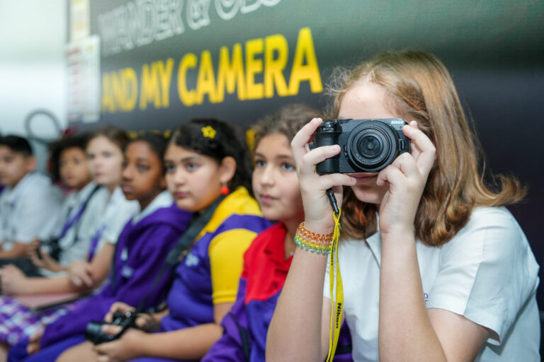 student taking some pictures with her camera